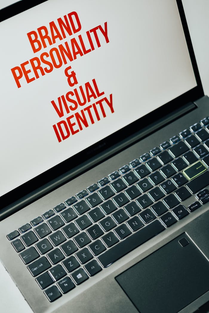 Mastering the First Impression: Your intriguing post title goes here Laptop screen showing text on brand personality and visual identity for marketing strategy.